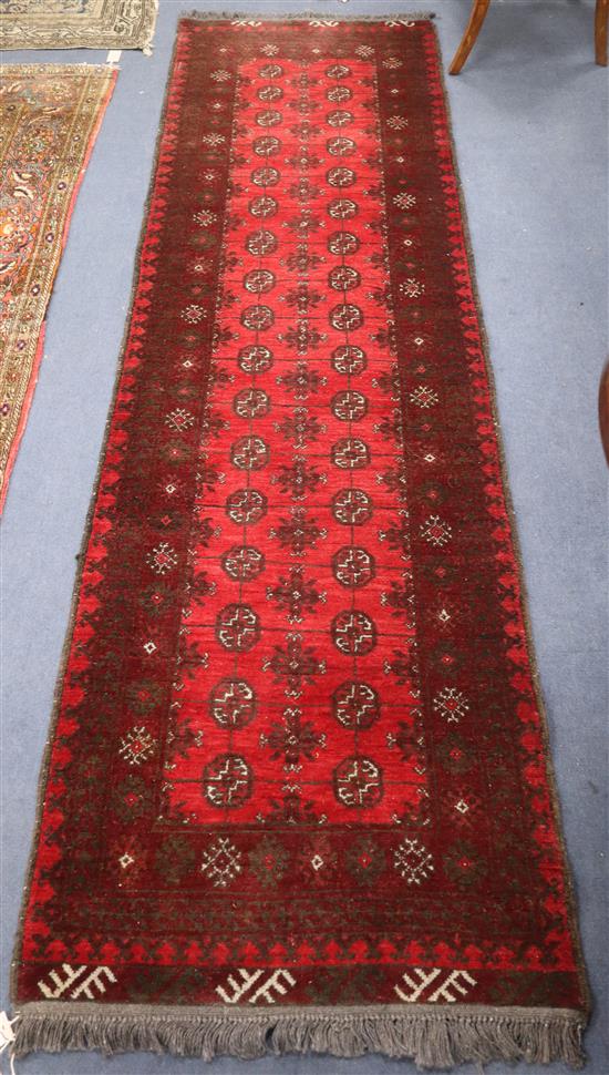 An Eastern red ground runner 275 x 78cm